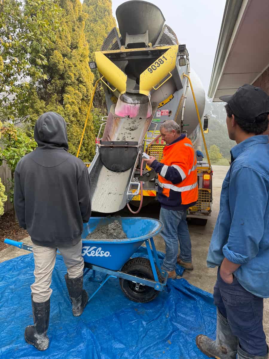 Civil contractors in Tasmania preparing concrete mix for a residential construction project.